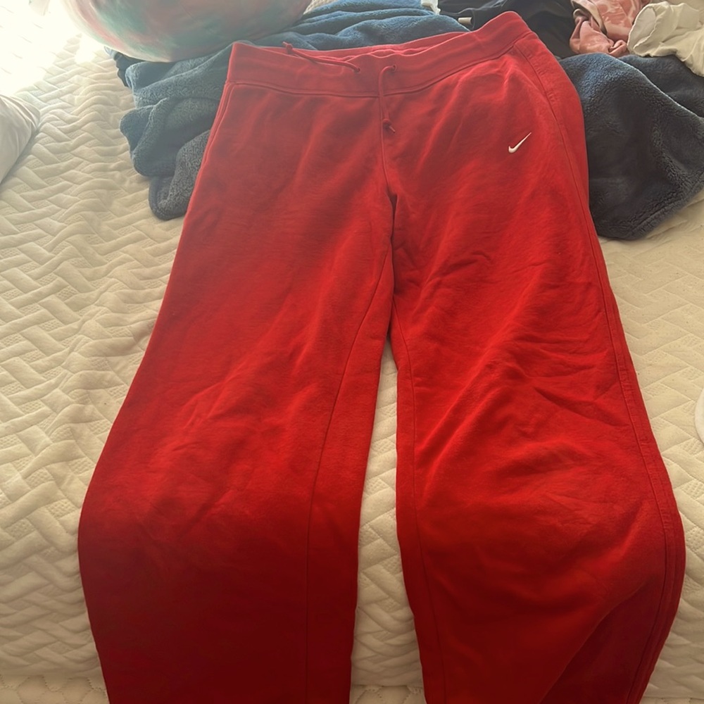 Red wide legged nike sweats